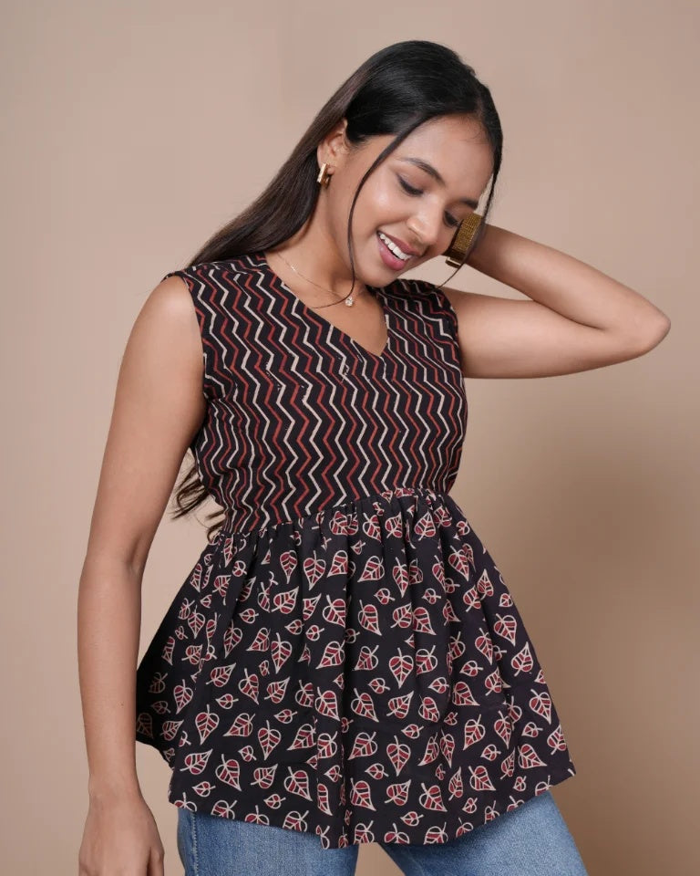 Siara Ajrakh pure cotton peplum top in black with chevron and leaf block print â€” front view | Kaarigar