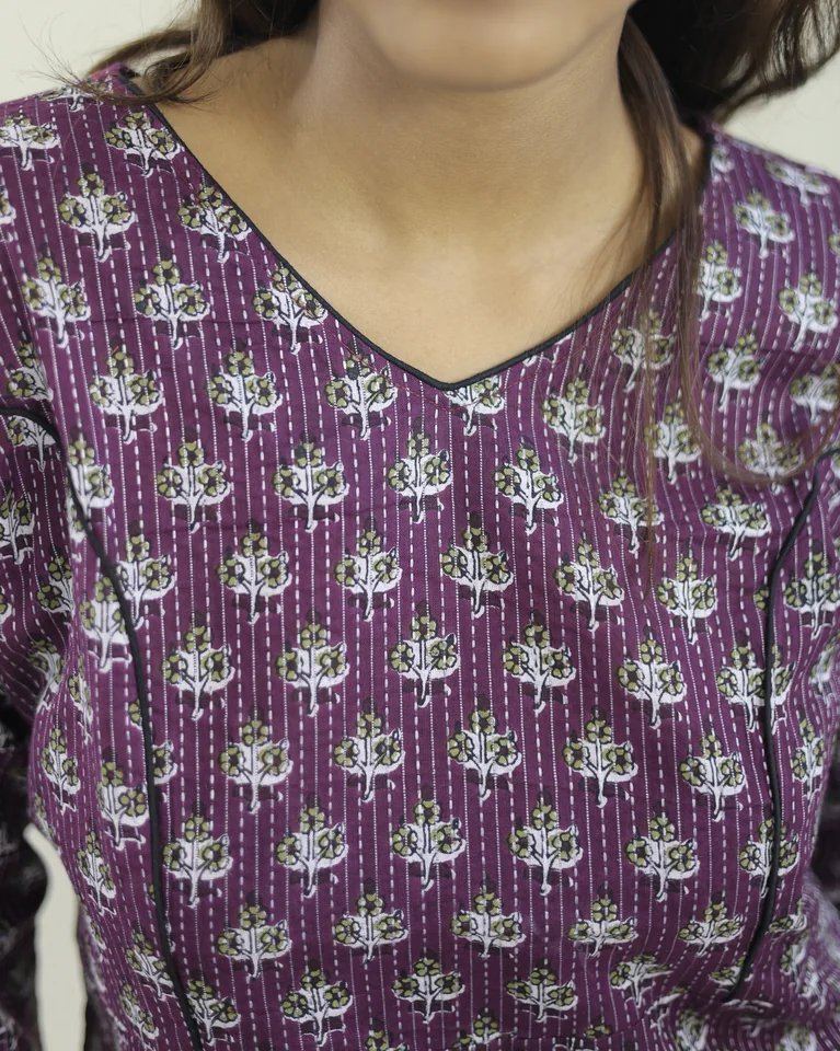 Close-up of Kantha running stitch and floral block print on plum cotton fabric — Elaaya kurti by Kaarigar