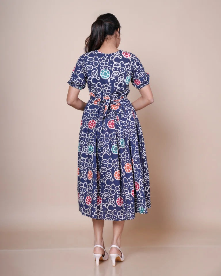 Elora Batik print cotton dress â€” back view showing tie-back waist detail and full flared skirt| Kaarigar